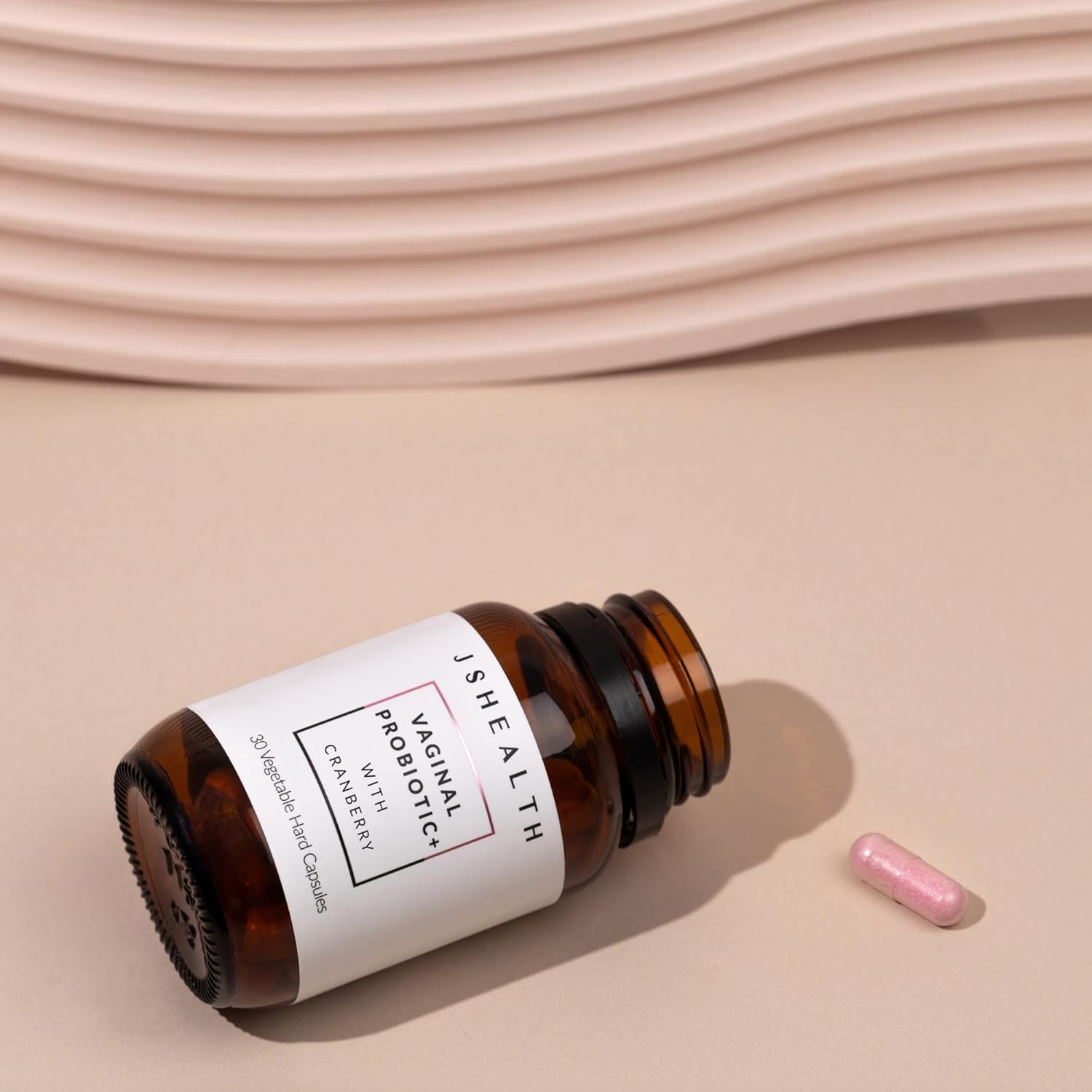 Brown bottle with a white label on a beige background