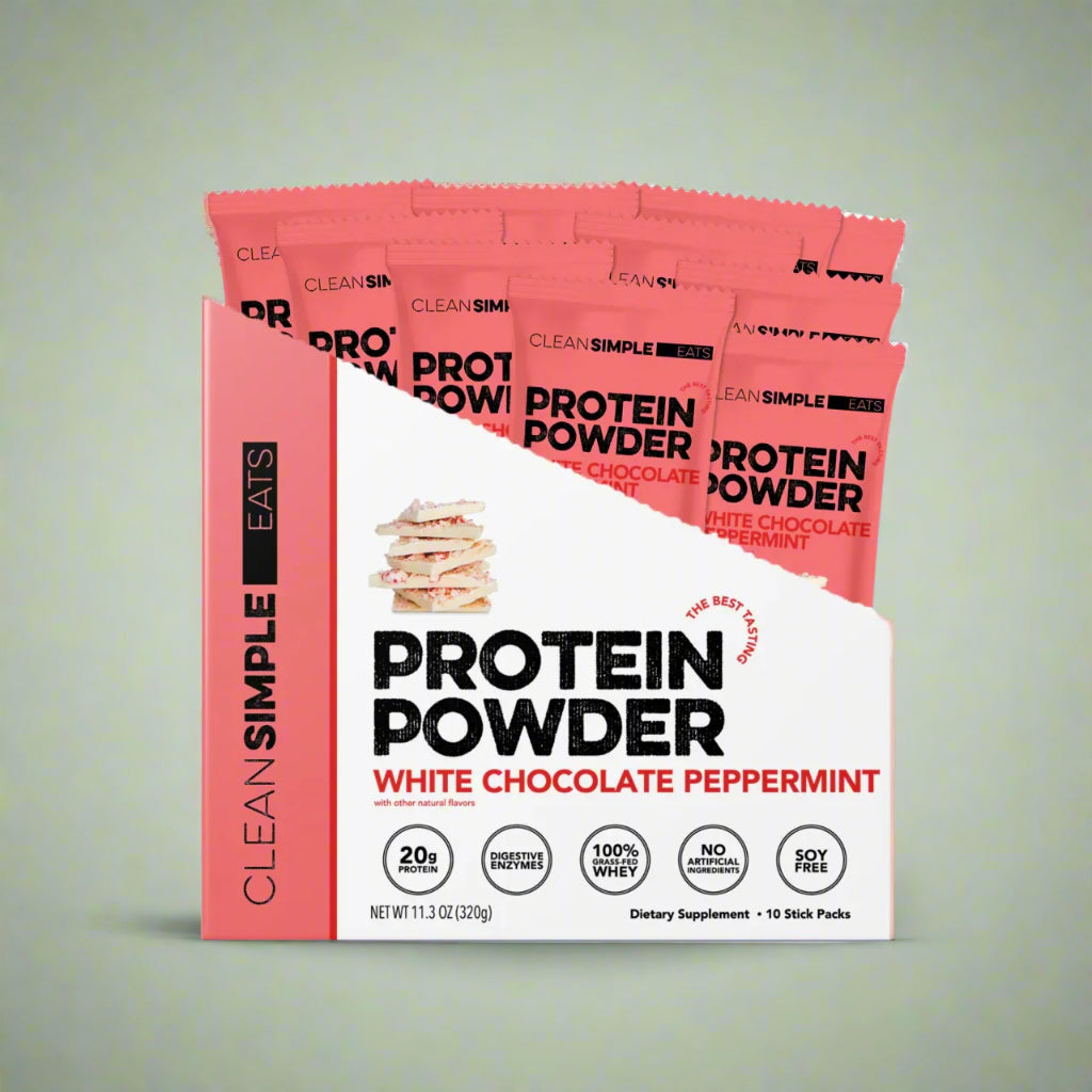 Protein powder package with white chocolate peppermint flavor on a pastel background.