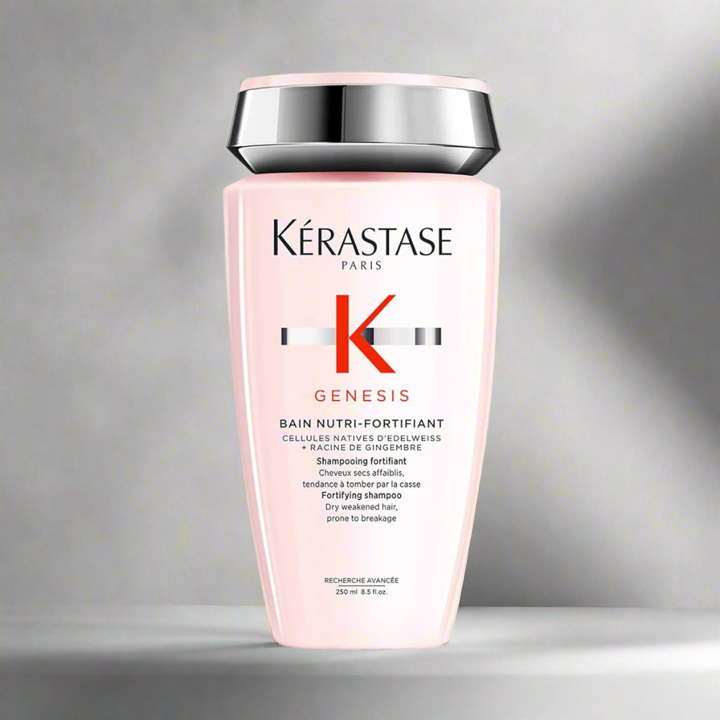 Kérastase Genesis shampoo bottle on a gray background