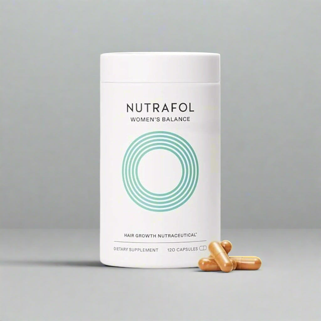 Nutrafol Women's Balance hair growth supplement container with capsules on a gray background