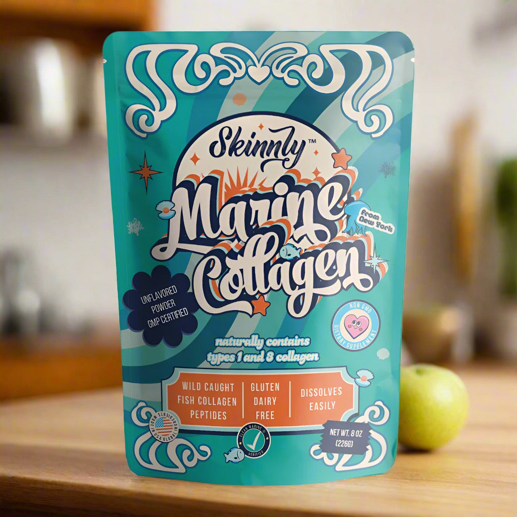 Skinnly Marine Collagen package on a wooden surface with a blurred background