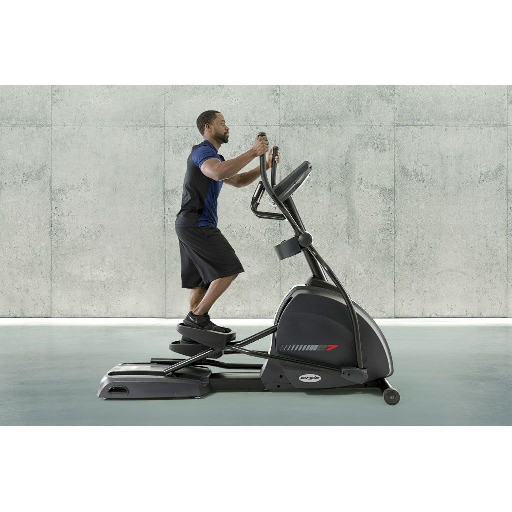 Circle Fitness E7 Elliptical with male athlete.