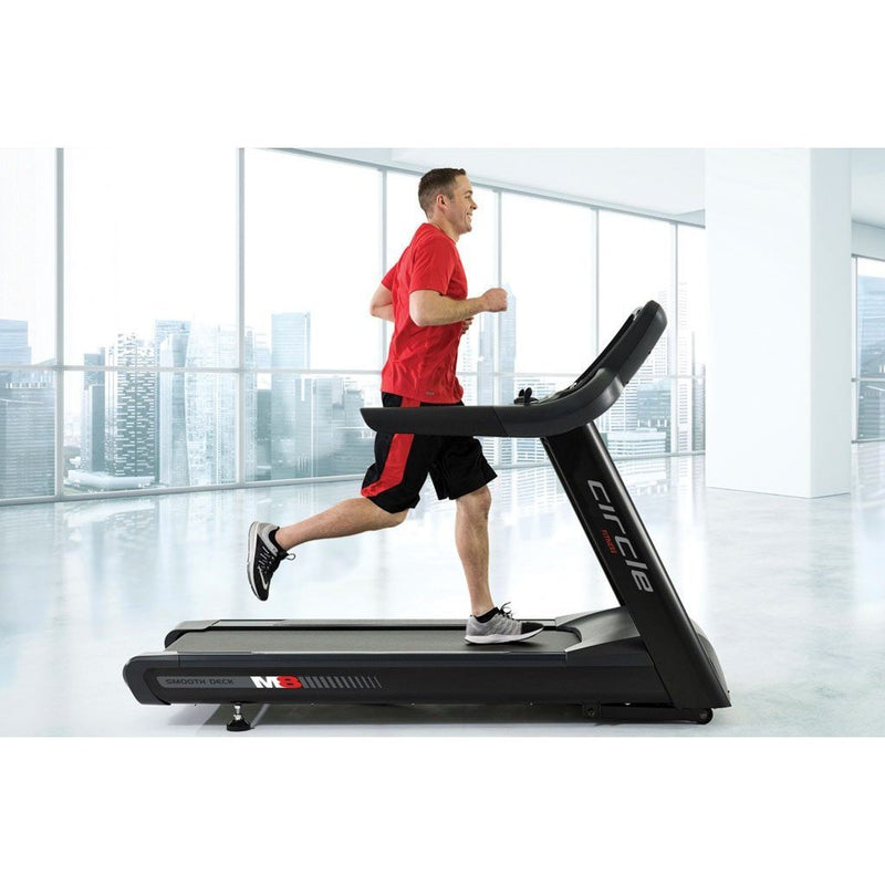 Circle Fitness M8 Treadmill with Athlete Running.