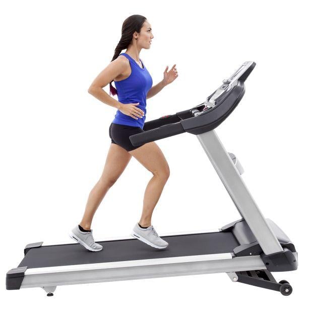 Female athlete jogging on the Spirit Fitness XT685 treadmill.