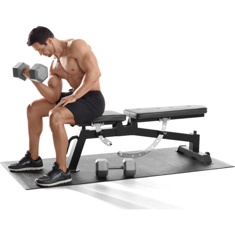Arm workout with a gym bench on the Proform Vinyl Exercise Mat.